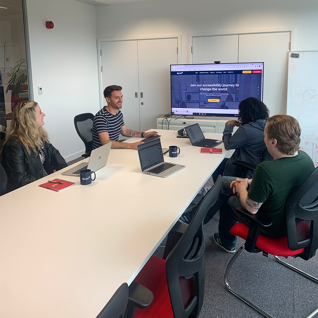 Recite Me staff working in meeting room