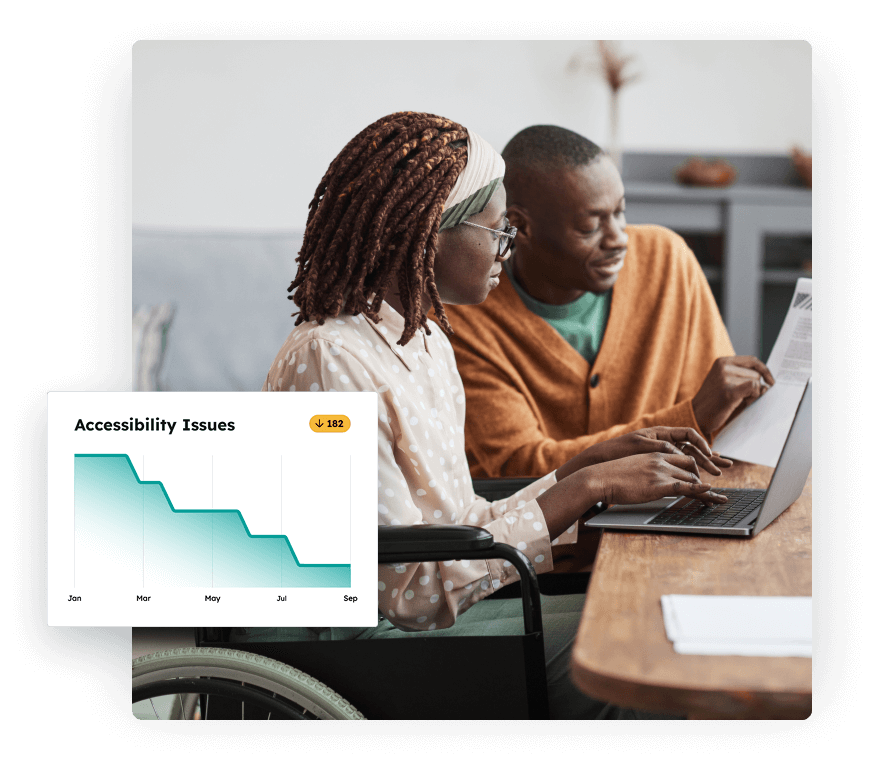Two colleagues collaborating at a desk, with one person in a wheelchair typing on a laptop while the other reviews a document. A graphic overlay shows a line chart labeled Accessibility Issues, with a steady decline from January to September and a total decrease of 182 issues.
